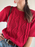 Maglia rossa a trecce